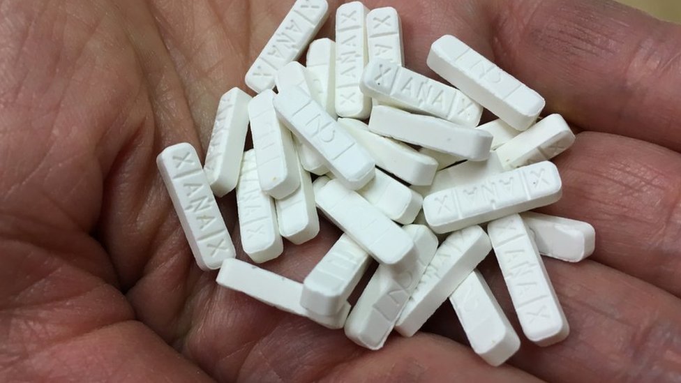 Doctor reviewing an Alprazolam prescription on a tablet, symbolizing fast online consultations.