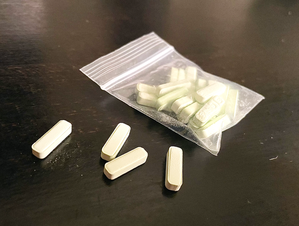 "Canadian flag with Xanax pills, representing safe online purchase from a Canadian pharmacy."
