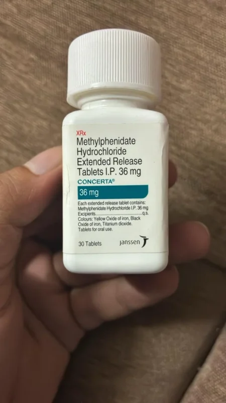 A person holding a box of Concerta 36 mg, representing safe online purchase options in New York City.
