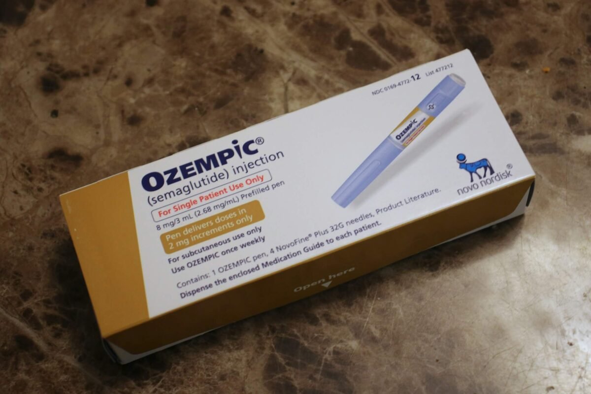 "A hand holding an Ozempic pen with a London skyline in the background, representing where to buy Ozempic online near me in London."