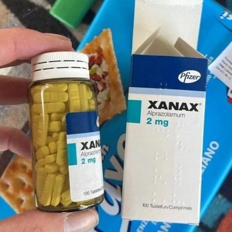 "Woman searching 'where to buy Xanax 2mg online near me in Florida' on her laptop."
