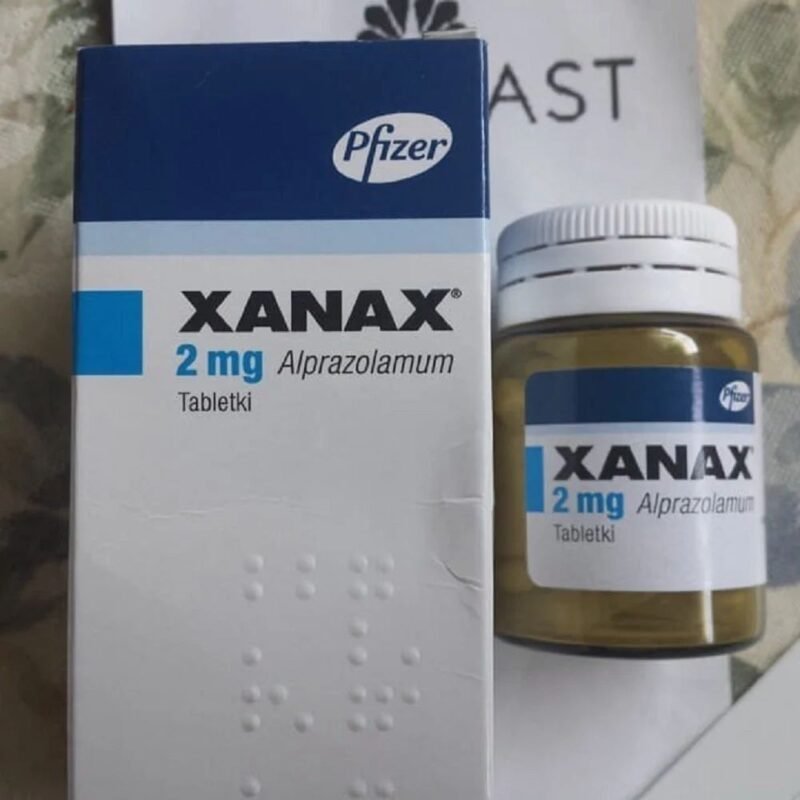 "A blister pack of Xanax 2mg tablets with a Delaware state outline in the background, representing safe online purchase options."